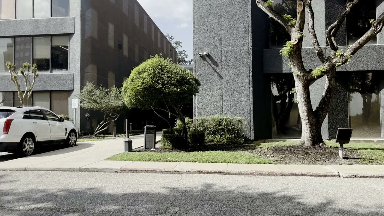 The front of the 8323 building from the parking lot